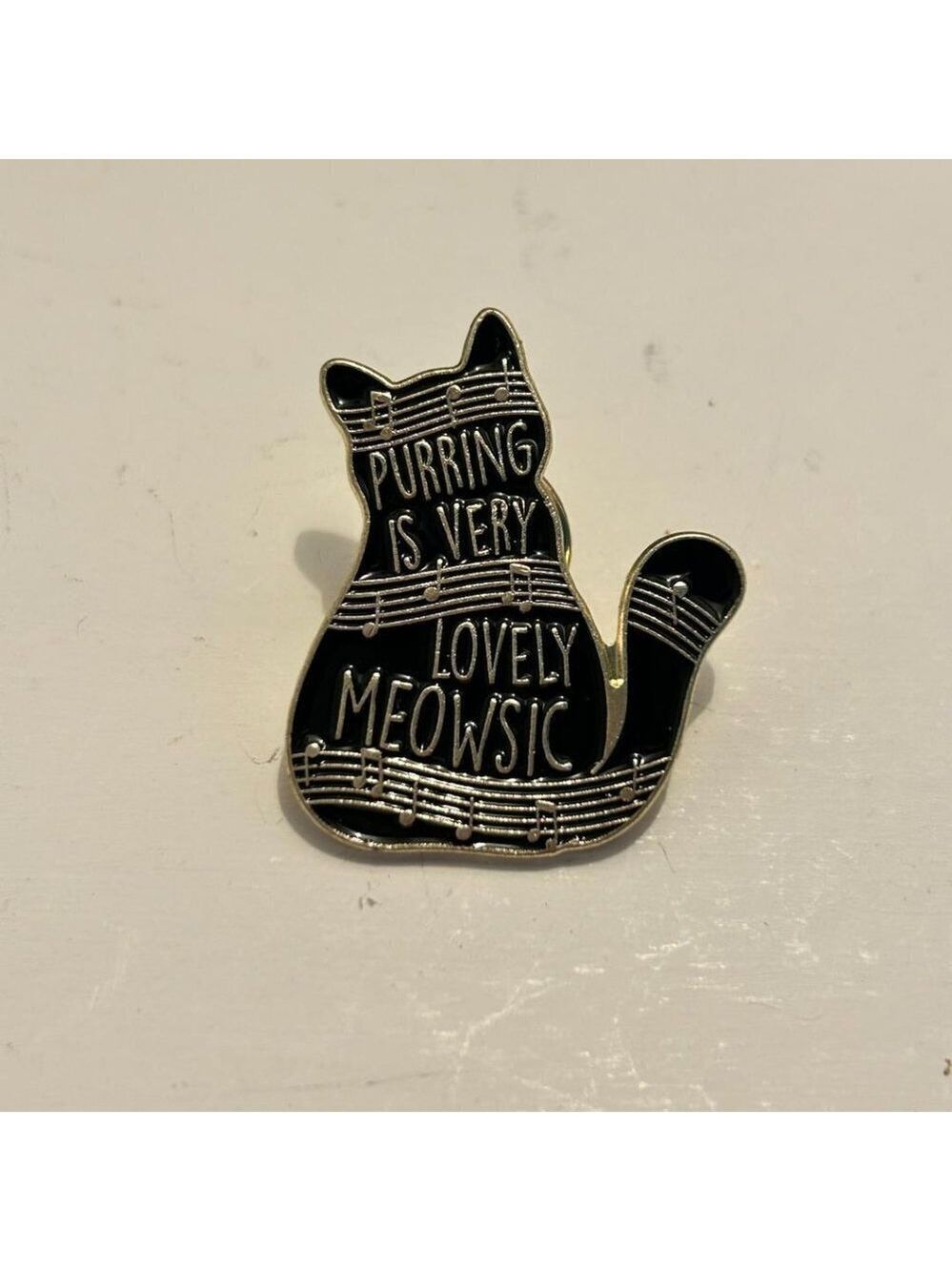 “purring is very lovely meowsic” cat pin